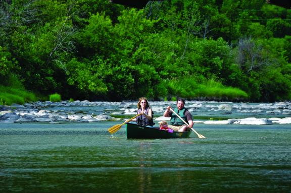 A group of people is canoeing on the Pembina River